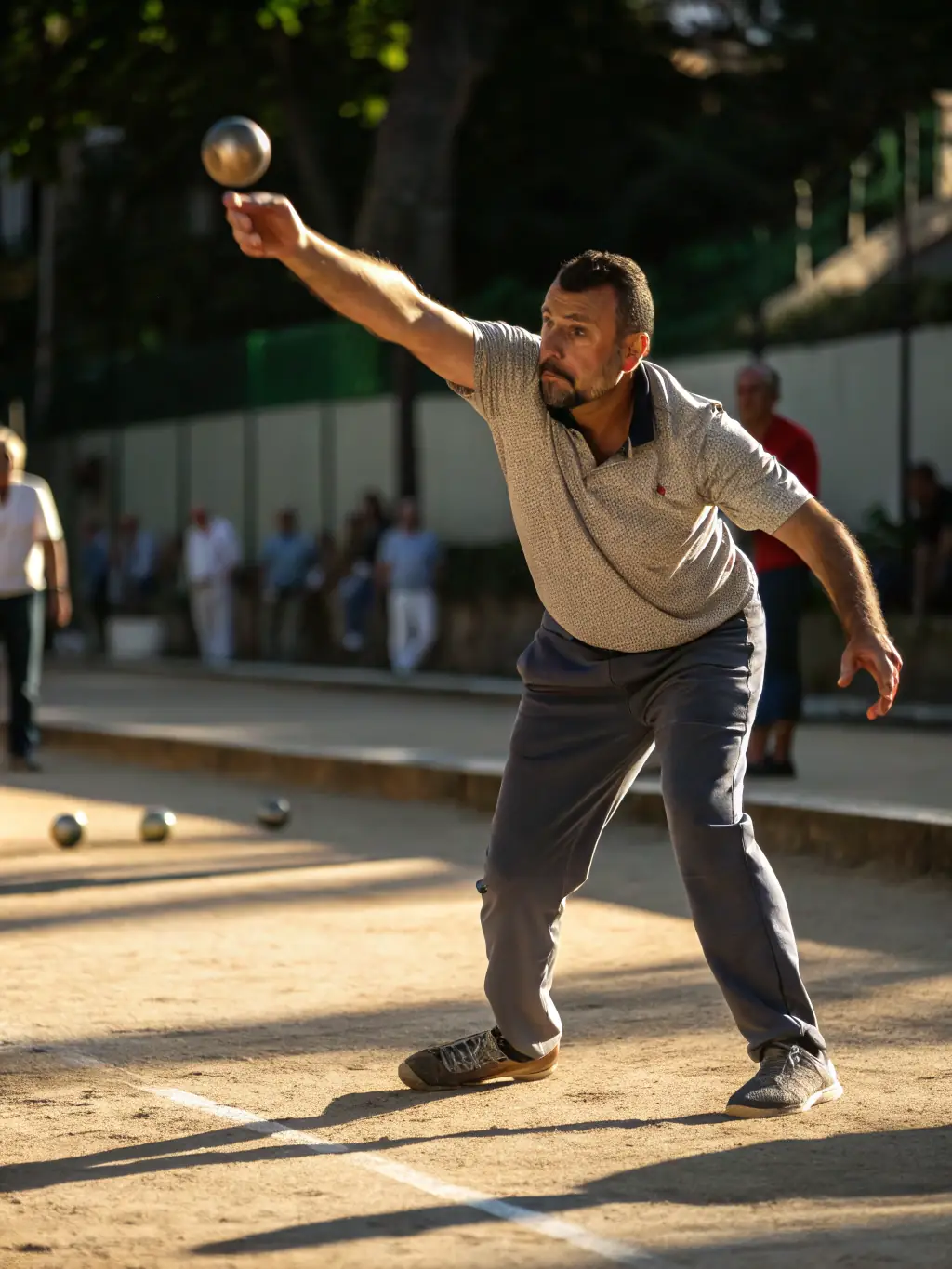 A close-up shot of boule players in action during a local tournament, showcasing the intensity and focus of the game.